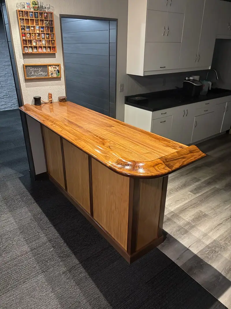 Side view of finished bar top made with a bar rail from Hardwoods Incorporated.